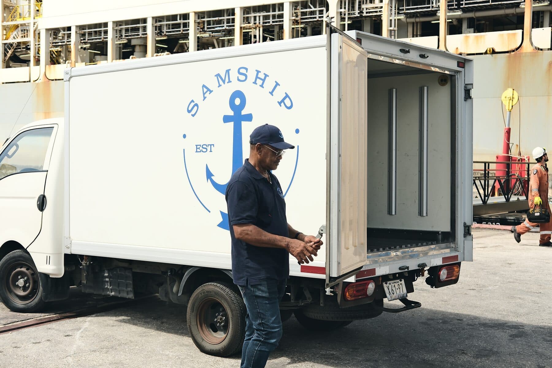 A Samship colleague at the open rear doors of a refrigerated delivery truck