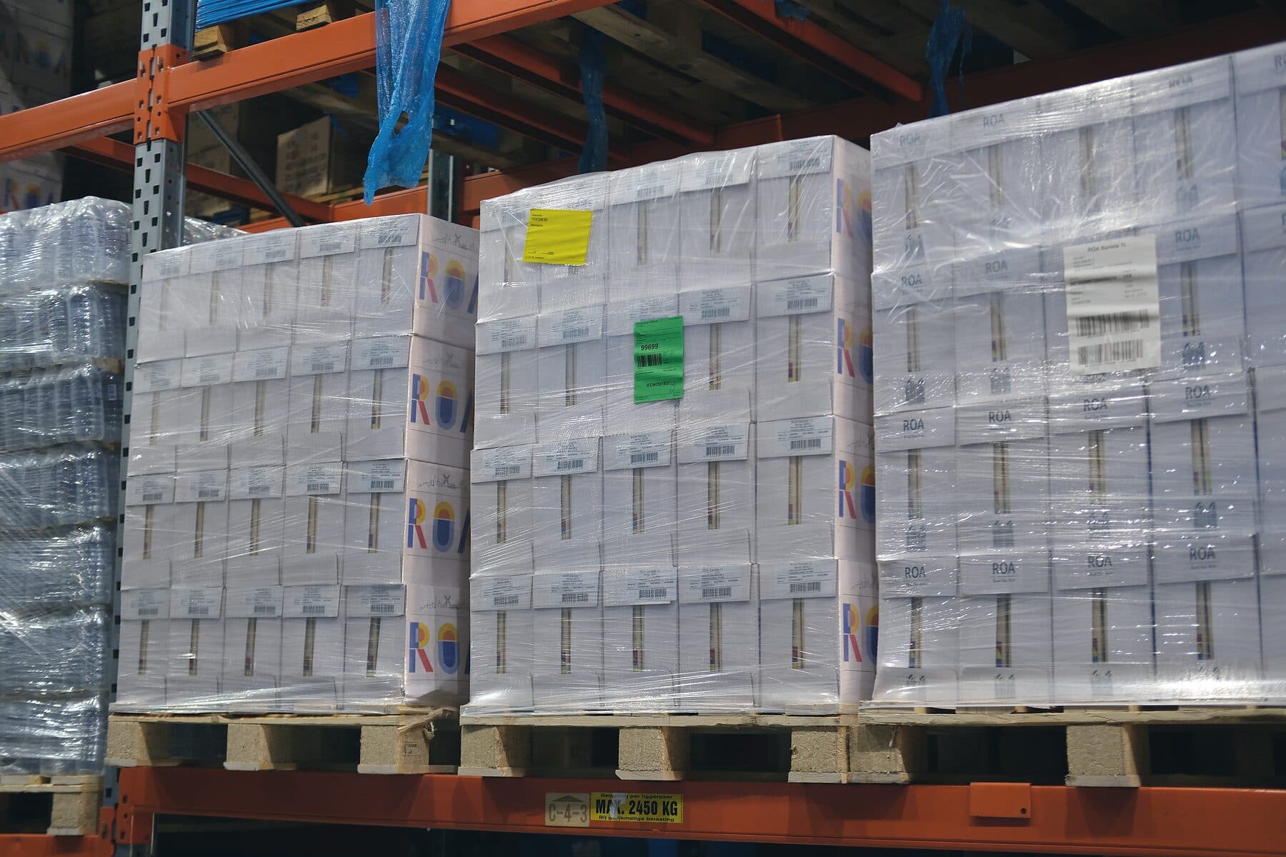 Shrink-wrapped pallets of stock on racking in the Samship warehouse